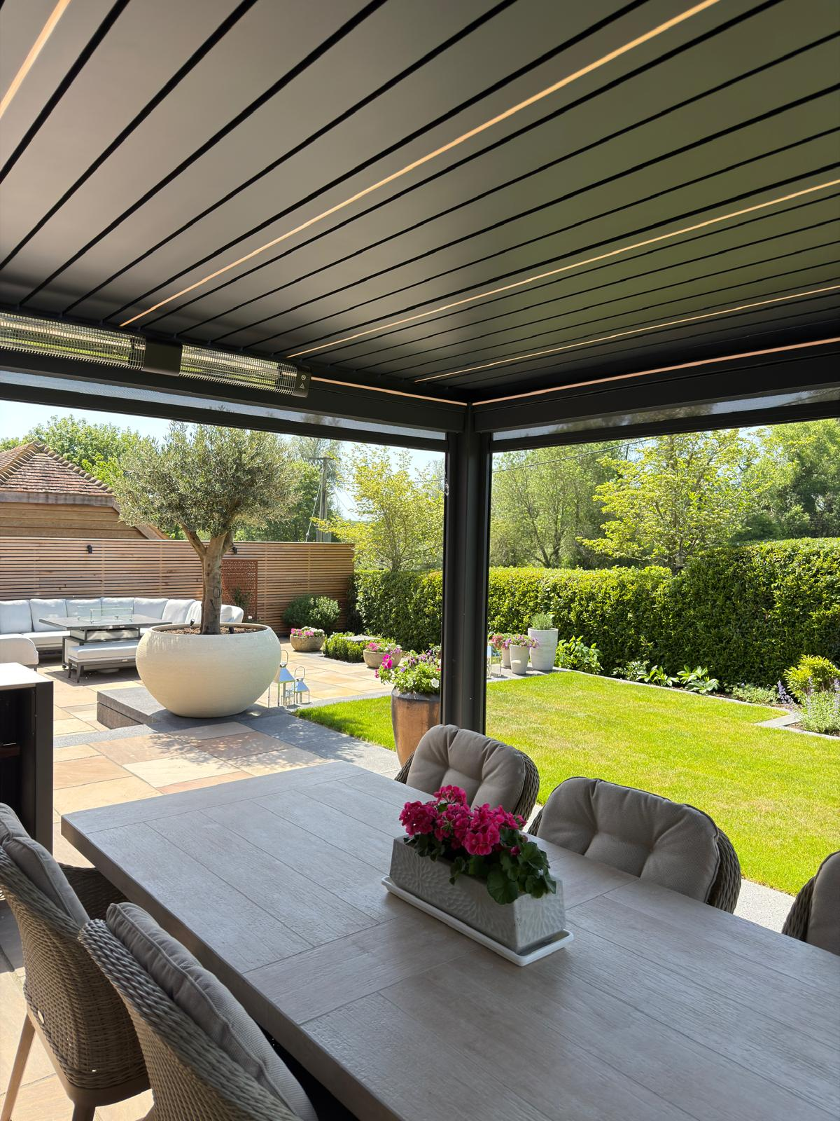 SOLA pergola interior with LED lighting and garden view